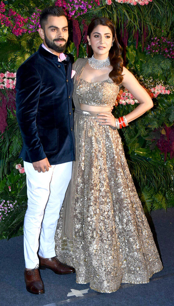 Kohli with wife Anushka Sharma in their Mumbai reception